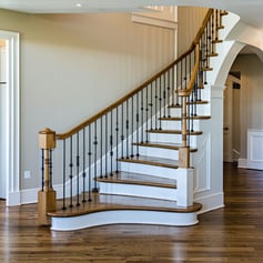 wood and metal combo railings on staircase inside a traditional home